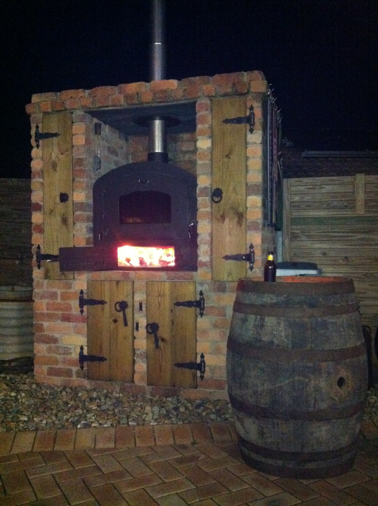 Wood fired oven in outdoor brick setting